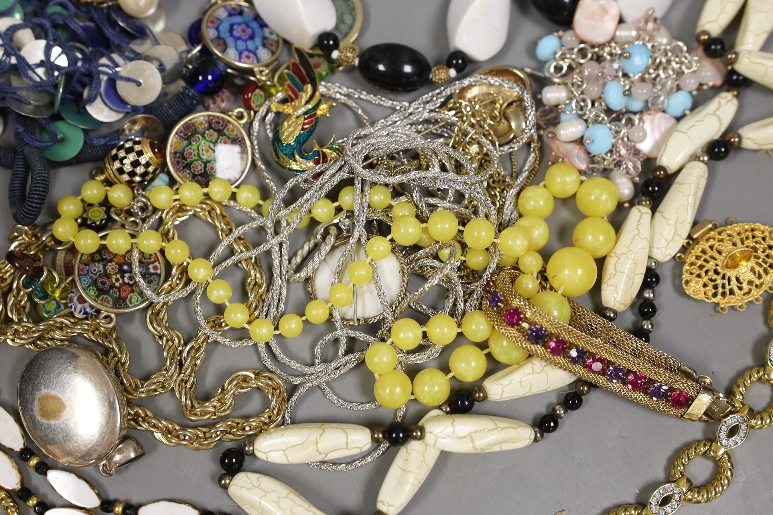 A quantity of assorted costume jewellery including necklaces, bracelets etc.